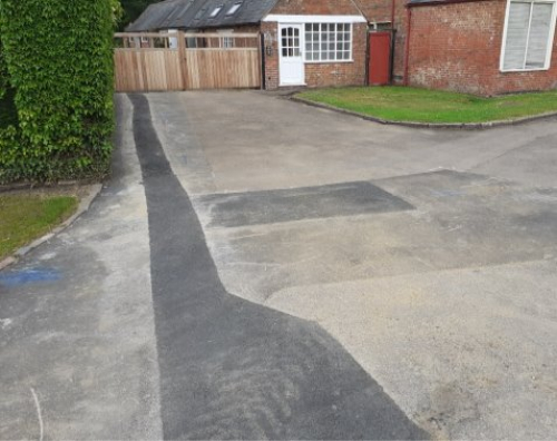 Photo showing differing shades of tarmac.